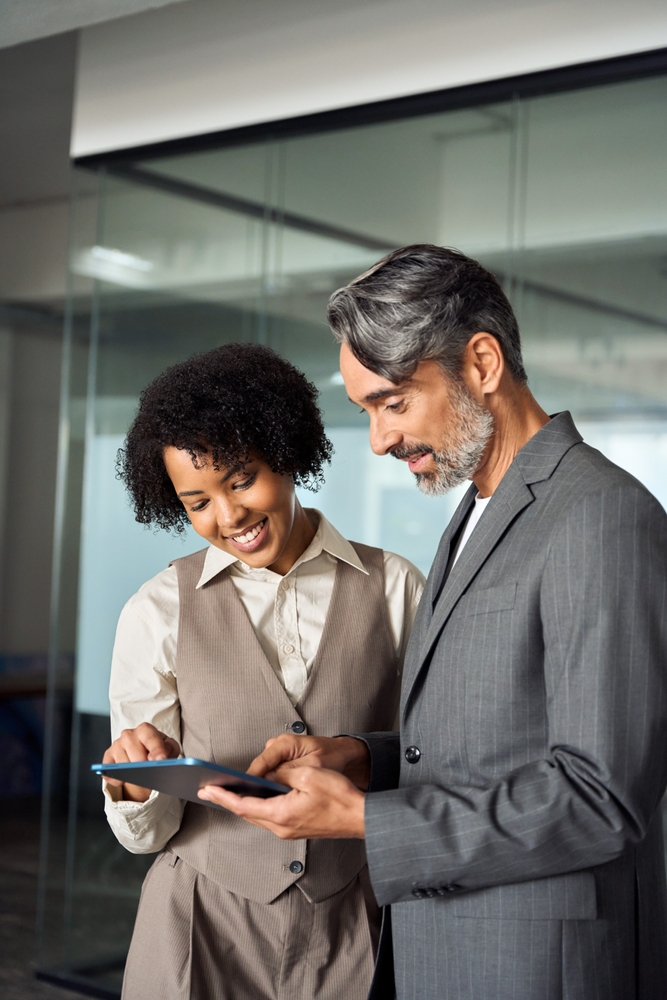 twobusyhappydiverseprofessionalbusinessteampeopleworkingin